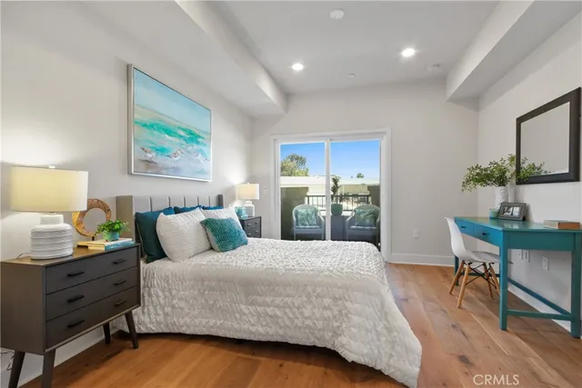 a bedroom with a bed and a table in it