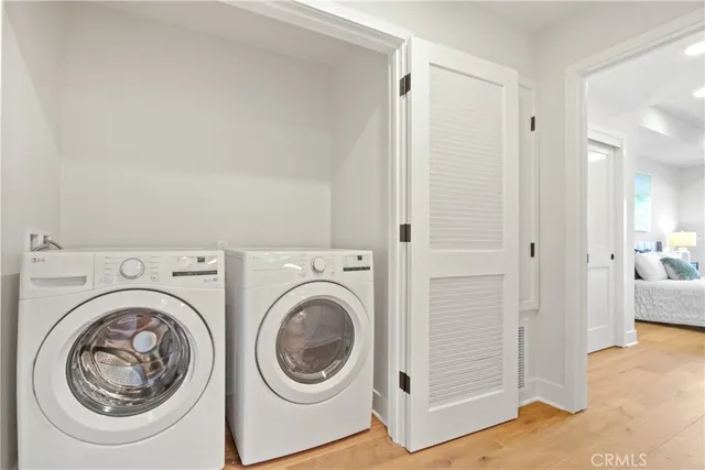 a view of a hallway with washer and dryer