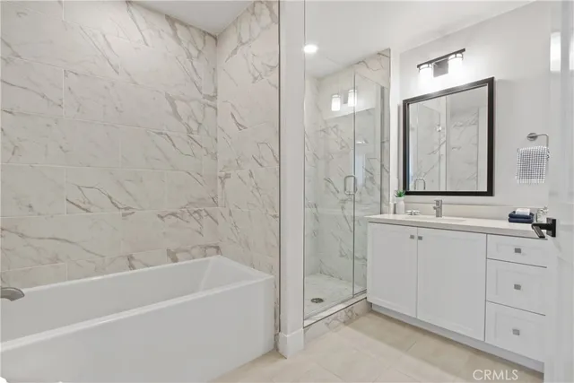 a bathroom with a bathtub and a sink