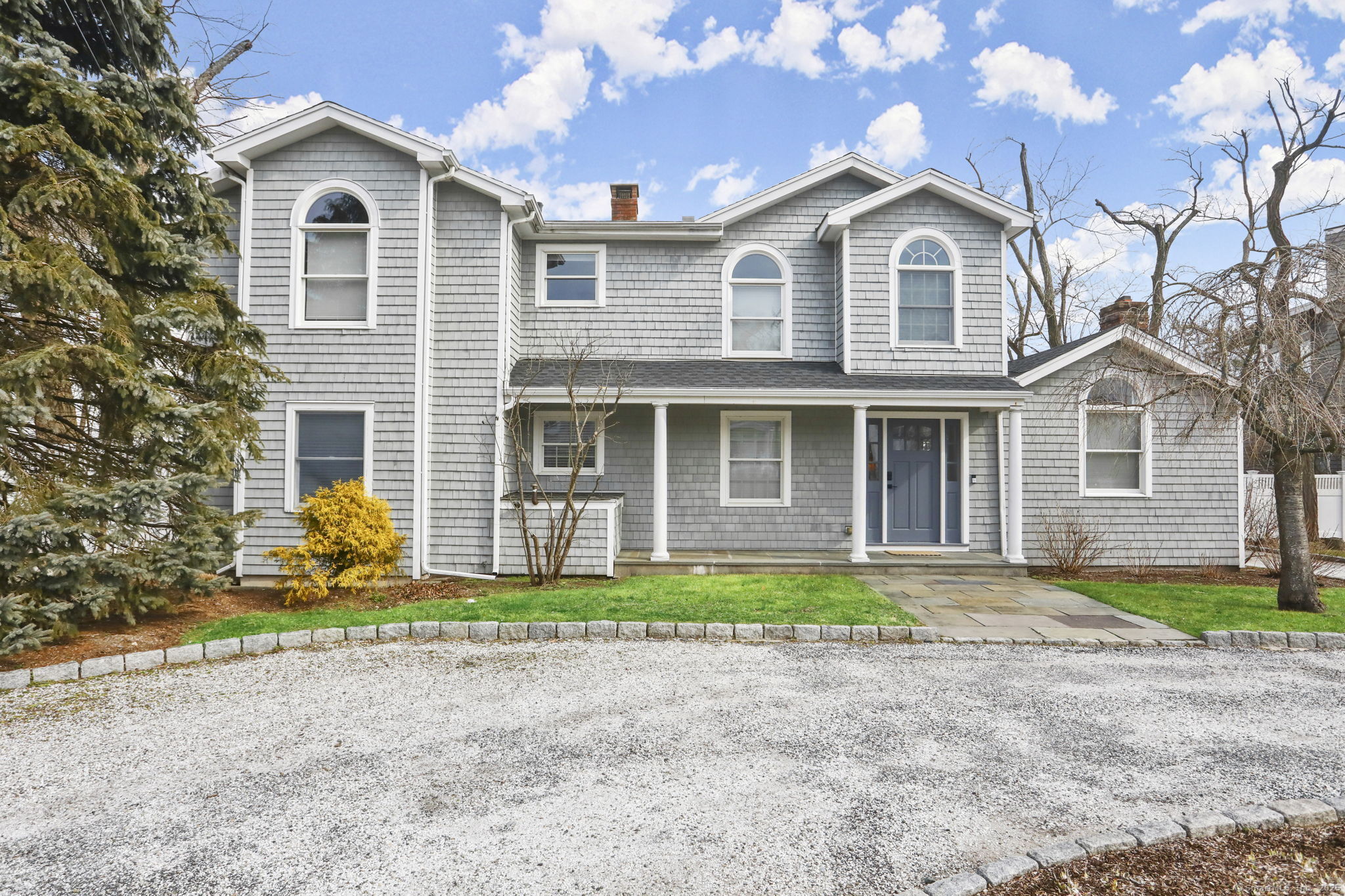 a front view of a house with garden