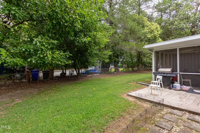 a view of a backyard with sitting area