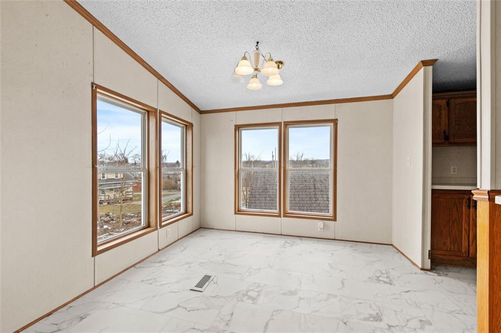 107 Indigo Road Mount Pleasant, PA 15666 - Photo 13 of 36 a view of an empty room with a window