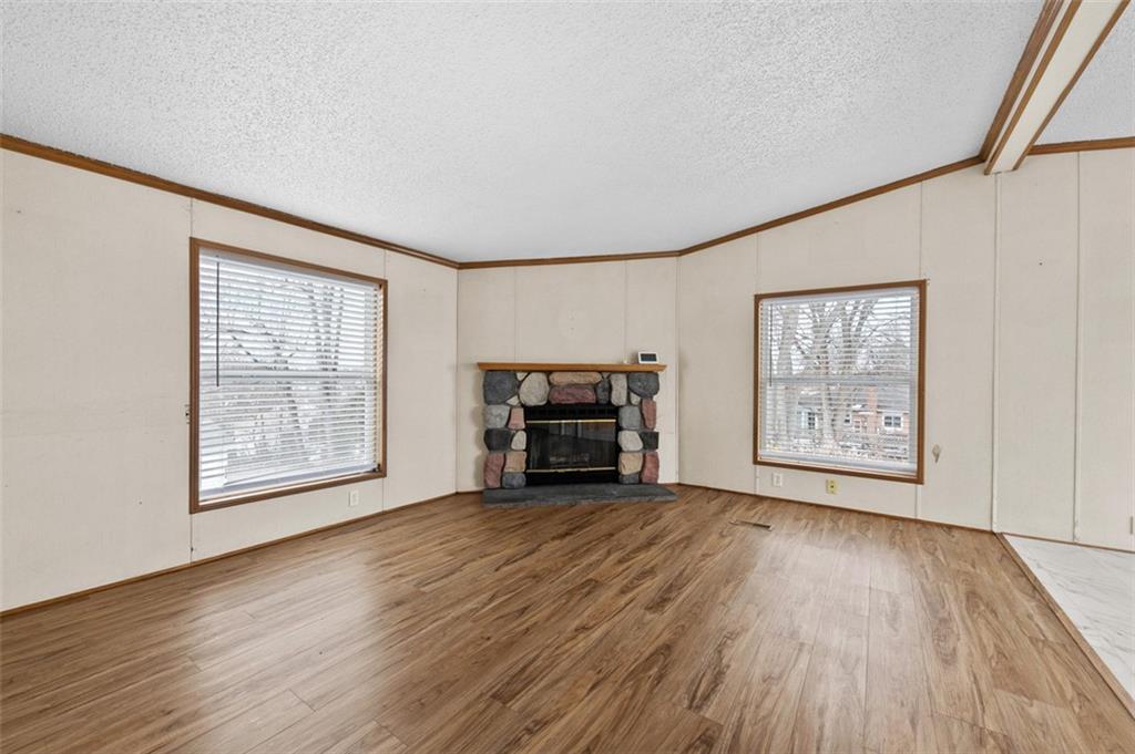 107 Indigo Road Mount Pleasant, PA 15666 - Photo 15 of 36 a view of an empty room with wooden floor and a window