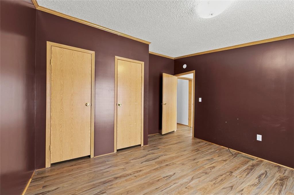 107 Indigo Road Mount Pleasant, PA 15666 - Photo 19 of 36 a view of empty room with wooden floor and closet