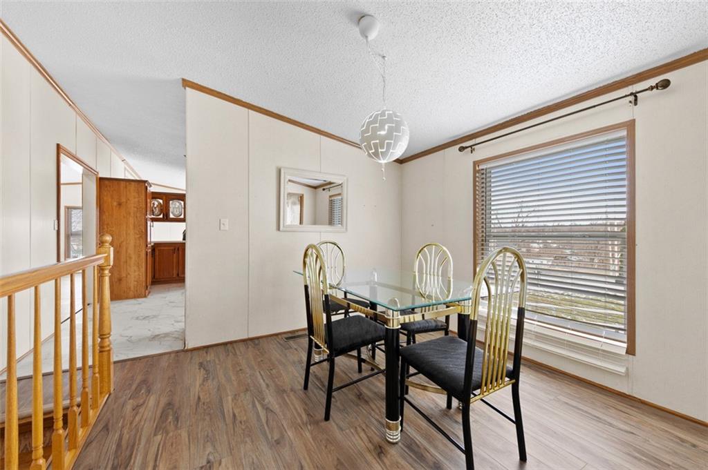 107 Indigo Road Mount Pleasant, PA 15666 - Photo 24 of 36 a view of a a dining room with furniture window and wooden floor