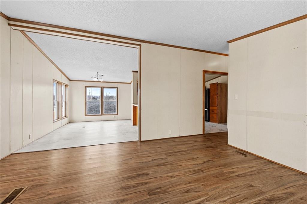 107 Indigo Road Mount Pleasant, PA 15666 - Photo 26 of 36 a view of an empty room with wooden floor and a window