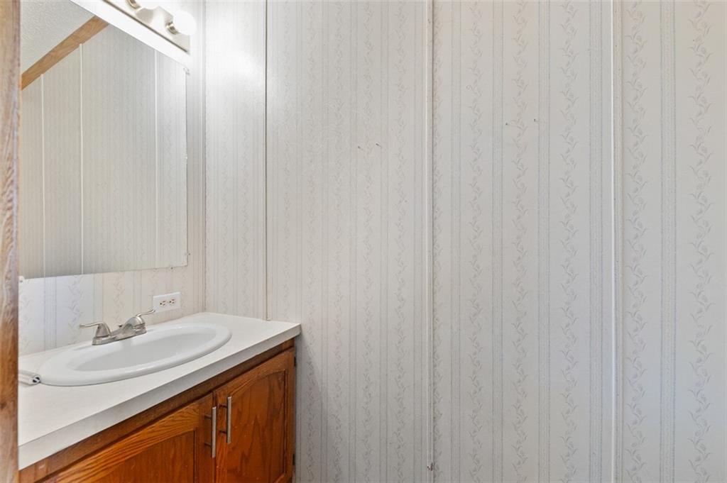 107 Indigo Road Mount Pleasant, PA 15666 - Photo 28 of 36 a bathroom with a sink and a mirror