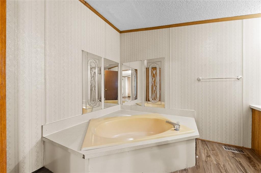 107 Indigo Road Mount Pleasant, PA 15666 - Photo 31 of 36 a white bath tub sitting next to a white sink