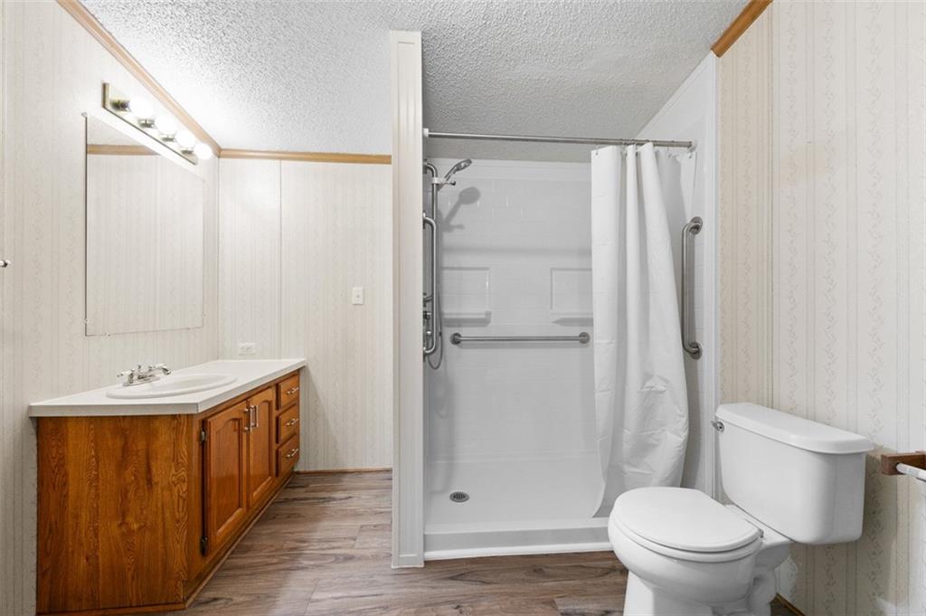 107 Indigo Road Mount Pleasant, PA 15666 - Photo 32 of 36 a bathroom with a granite countertop sink toilet and shower