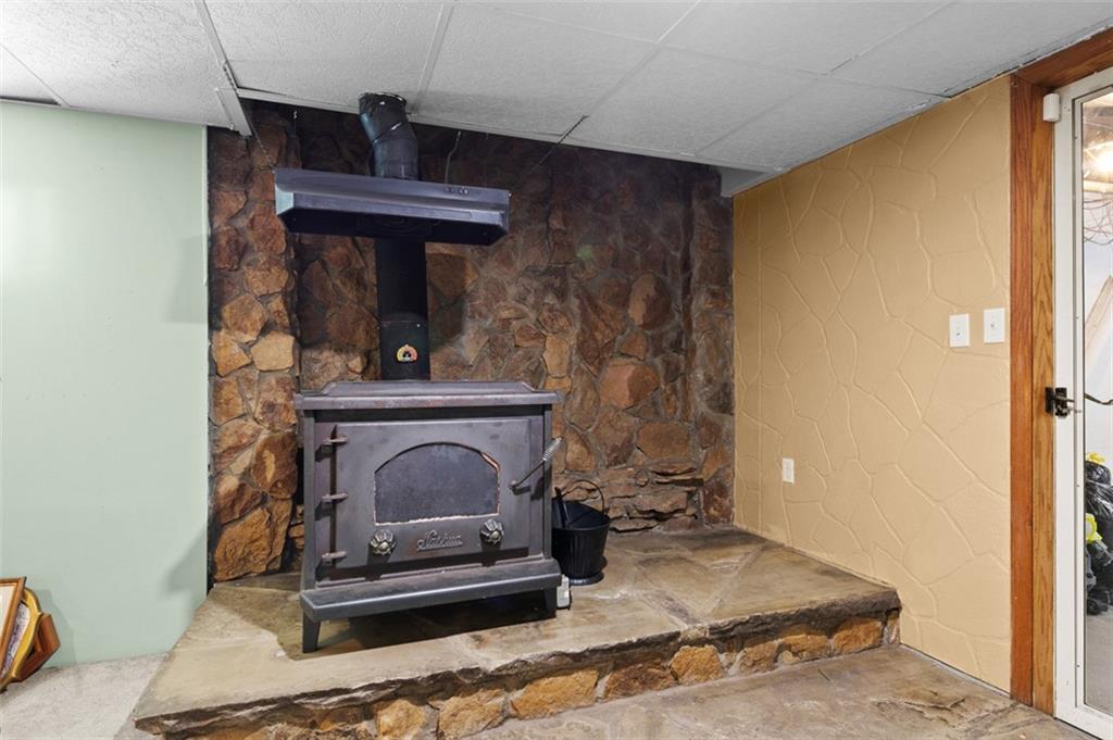 107 Indigo Road Mount Pleasant, PA 15666 - Photo 34 of 36 a living room with fireplace furniture and a window