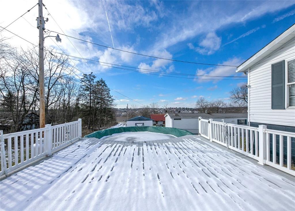 107 Indigo Road Mount Pleasant, PA 15666 - Photo 4 of 36 a view of a terrace with wooden floor and fence