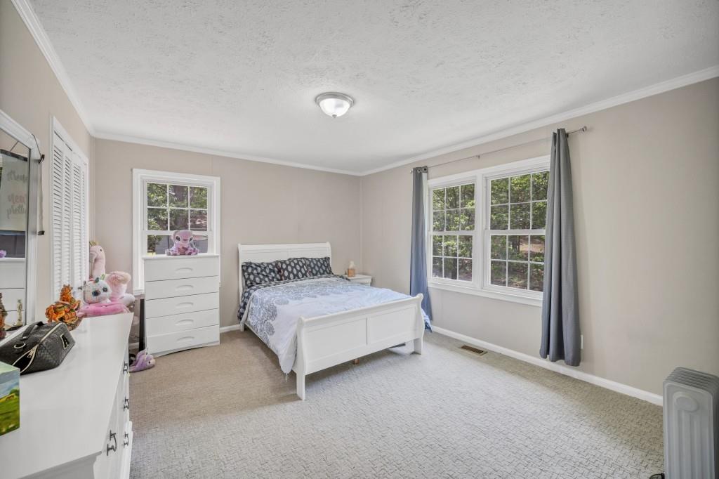 83 Summit Ridge Circle Southeast Cartersville, GA 30120 - Photo 17 of 32 a bedroom with a bed and a window