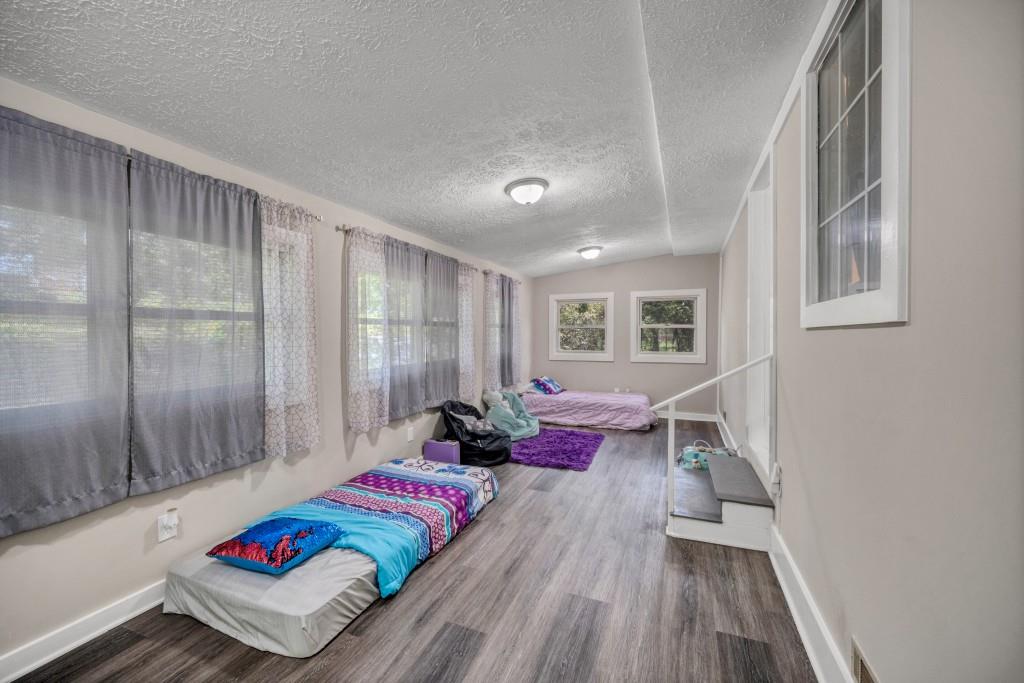 83 Summit Ridge Circle Southeast Cartersville, GA 30120 - Photo 23 of 32 a living room with furniture and wooden floor
