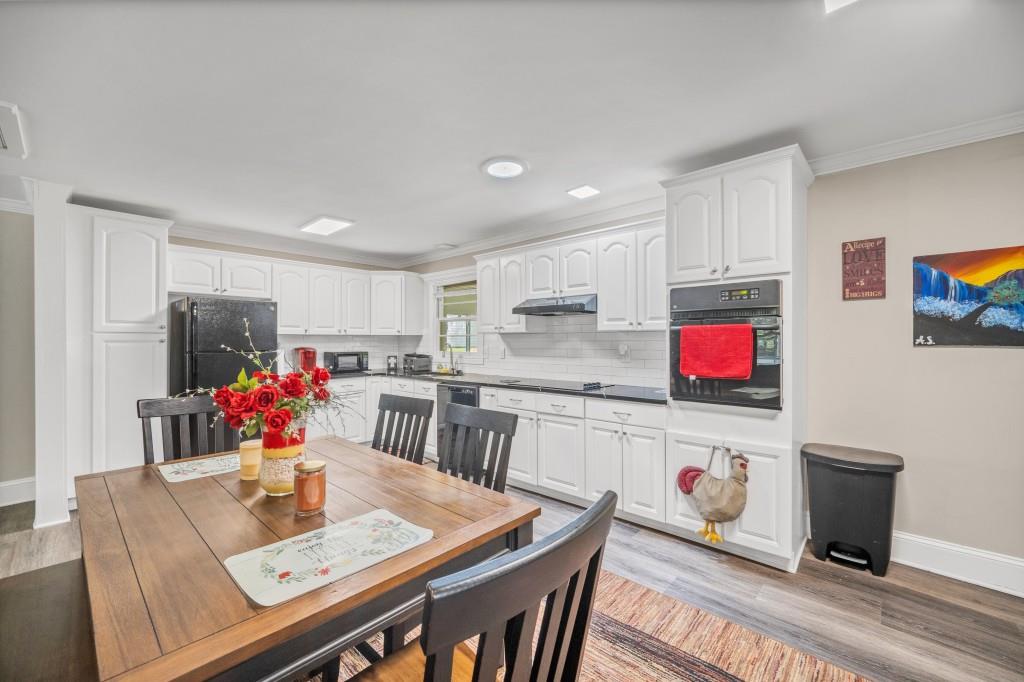 83 Summit Ridge Circle Southeast Cartersville, GA 30120 - Photo 10 of 32 a living room with stainless steel appliances furniture a kitchen view and a refrigerator