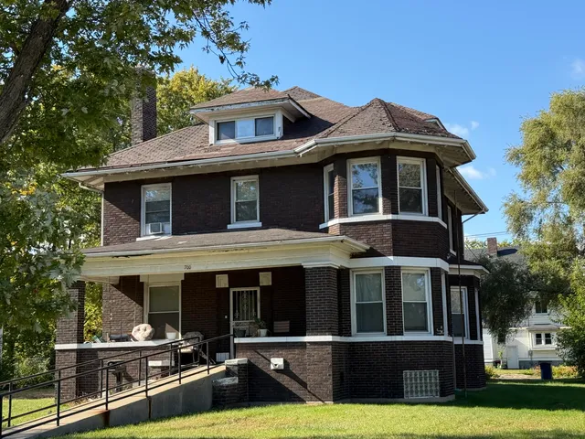 a front view of a house with yard