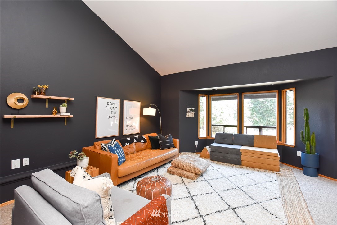 14516 Connelly Road Snohomish, WA 98296 - Photo 18 of 40 a living room with furniture and a large window