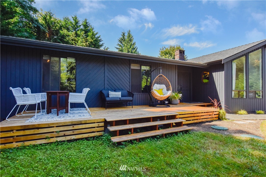 14516 Connelly Road Snohomish, WA 98296 - Photo 3 of 40 a view of a backyard with a wooden deck and furniture