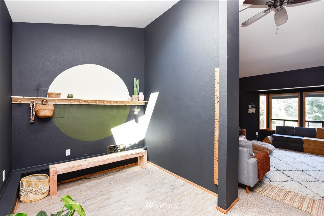 14516 Connelly Road Snohomish, WA 98296 - Photo 21 of 40 a room with furniture and a wooden floor