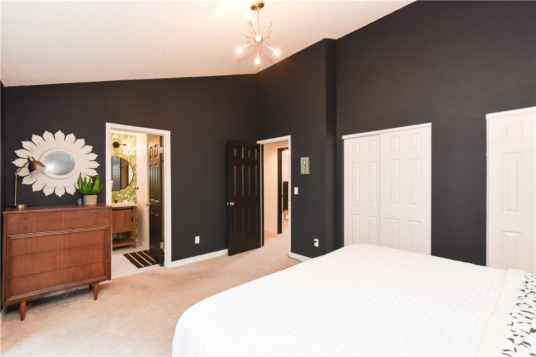 14516 Connelly Road Snohomish, WA 98296 - Photo 25 of 40 a bedroom with a bed and a dresser