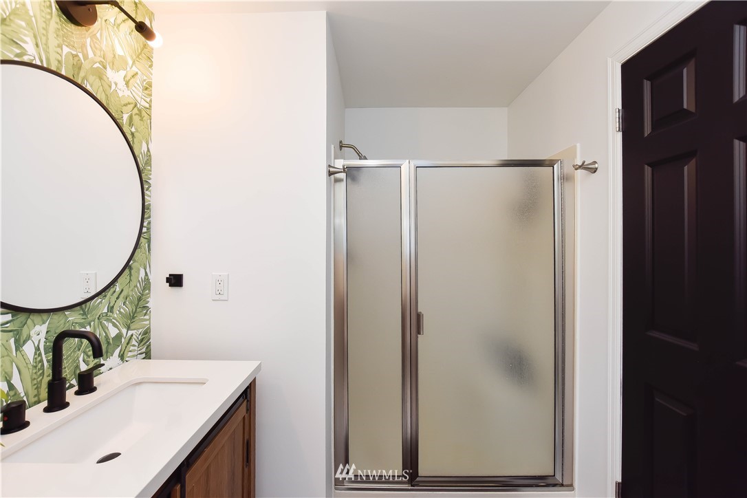 14516 Connelly Road Snohomish, WA 98296 - Photo 28 of 40 a bathroom with a sink mirror and vanity