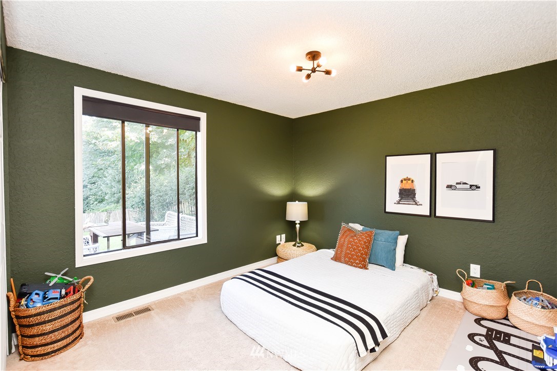 14516 Connelly Road Snohomish, WA 98296 - Photo 29 of 40 a bedroom with a bed and a window