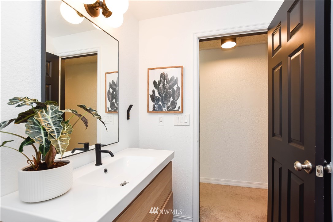 14516 Connelly Road Snohomish, WA 98296 - Photo 32 of 40 a bathroom with a sink and a mirror