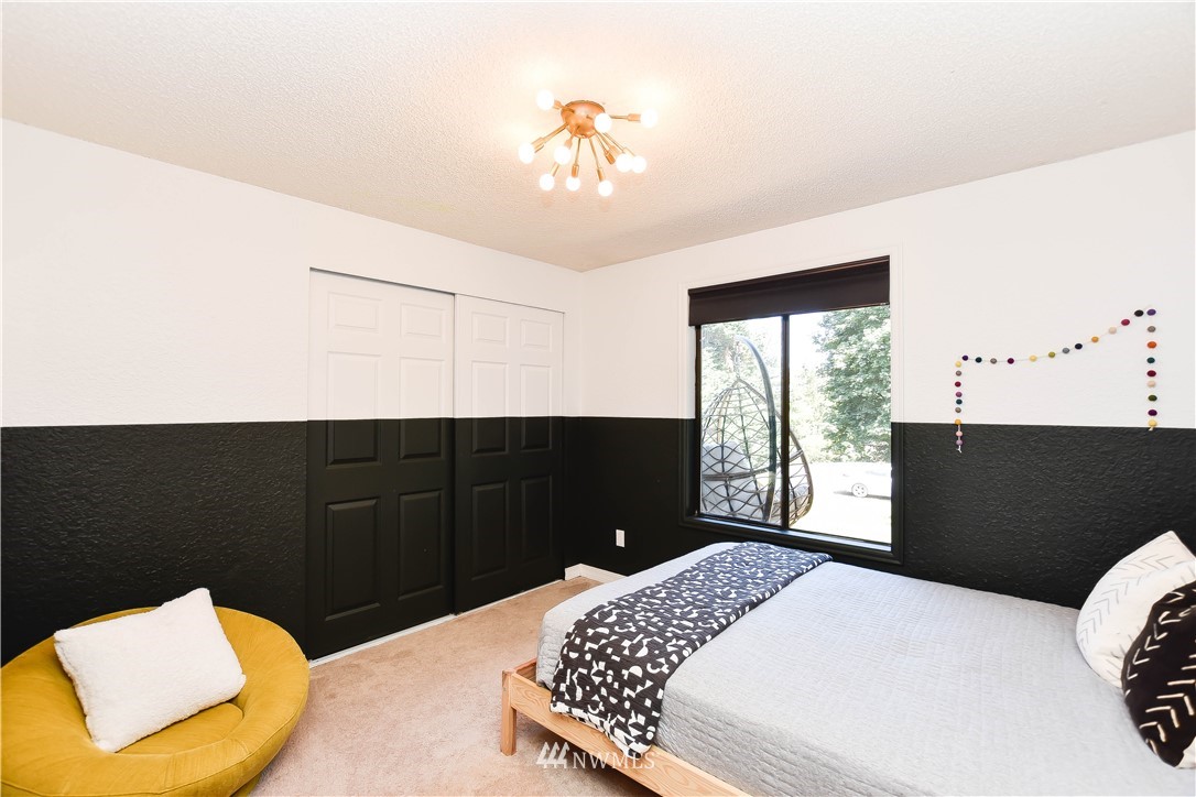 14516 Connelly Road Snohomish, WA 98296 - Photo 34 of 40 a bedroom with a bed and a window