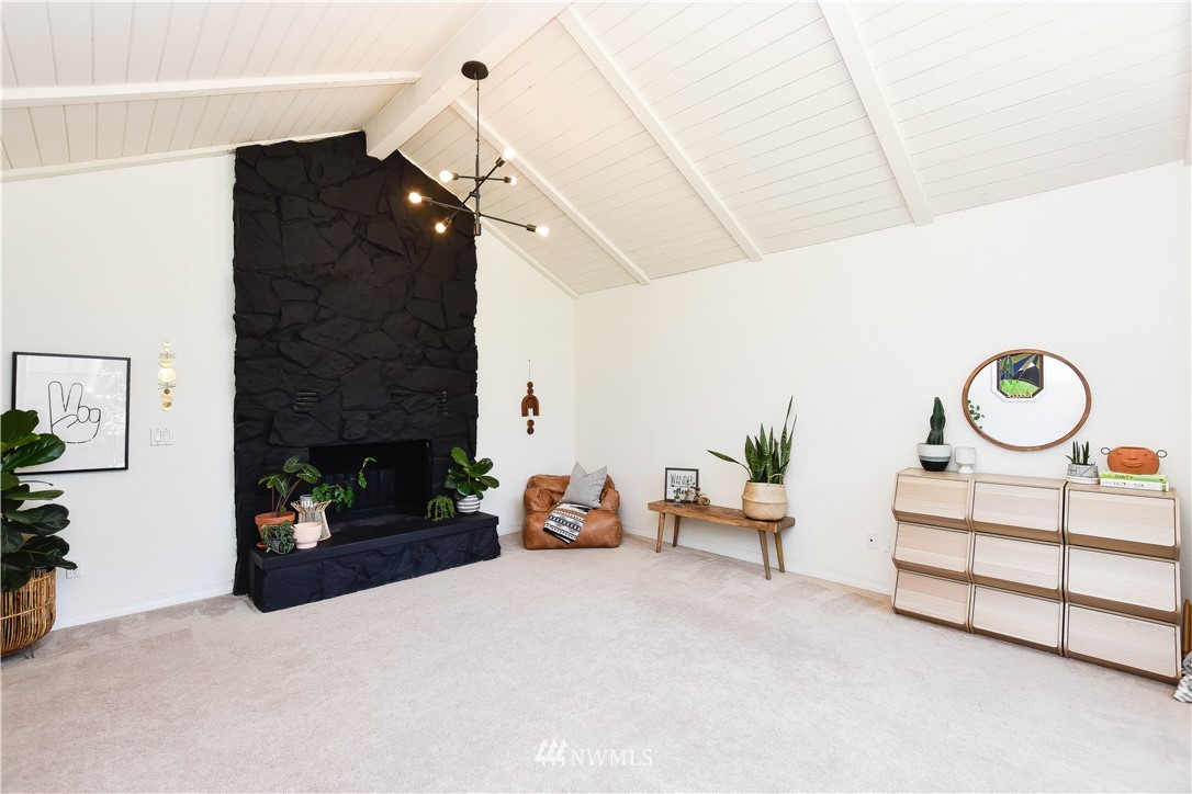 14516 Connelly Road Snohomish, WA 98296 - Photo 5 of 40 a living room with furniture and a fireplace