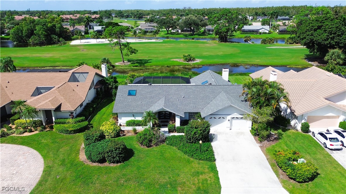 an aerial view of a house with outdoor space and street view