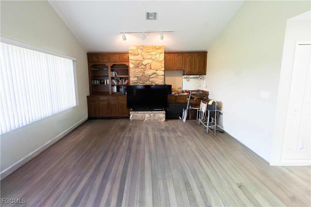 14557 Eagle Ridge Drive Fort Myers, FL 33912 - Photo 11 of 20 a view of a room with wooden floor furniture and windows
