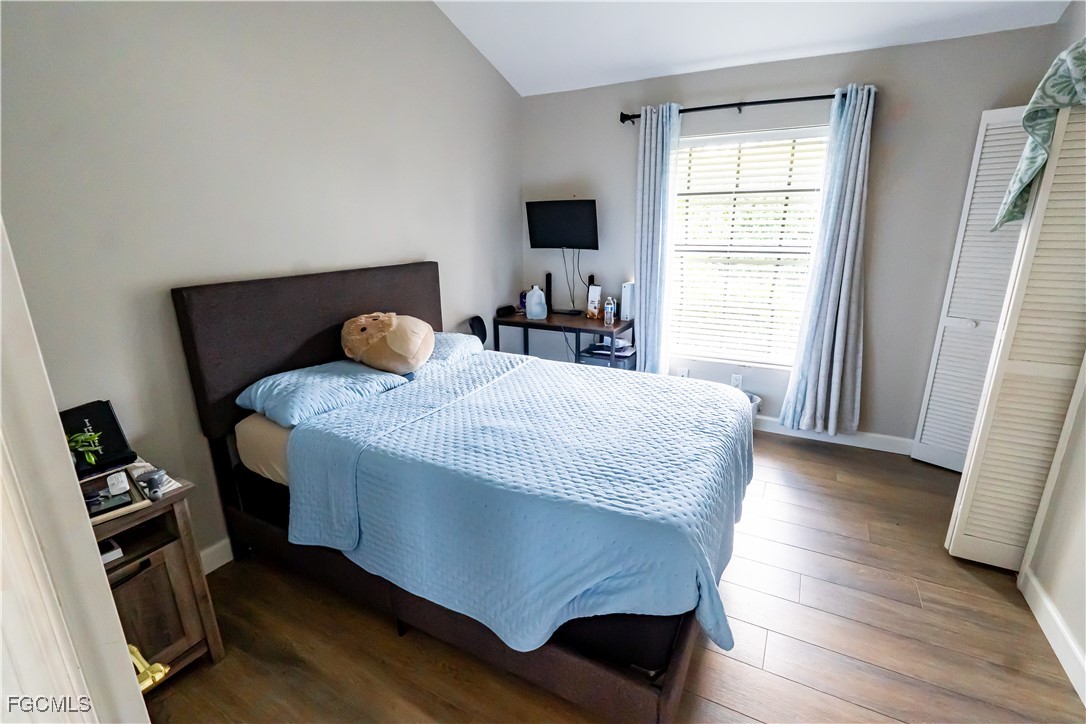14557 Eagle Ridge Drive Fort Myers, FL 33912 - Photo 12 of 20 a bedroom with a bed and a window