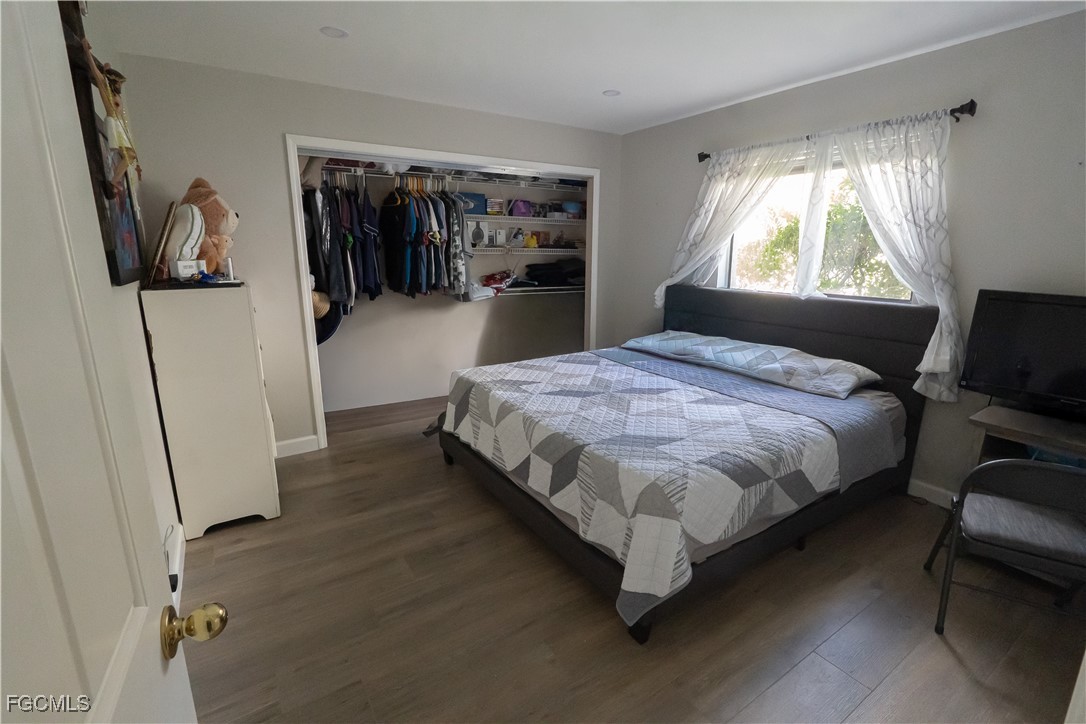 14557 Eagle Ridge Drive Fort Myers, FL 33912 - Photo 14 of 20 a bedroom with a bed closet and a window