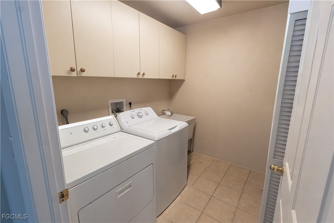 14557 Eagle Ridge Drive Fort Myers, FL 33912 - Photo 16 of 20 a utility room with dryer and washer