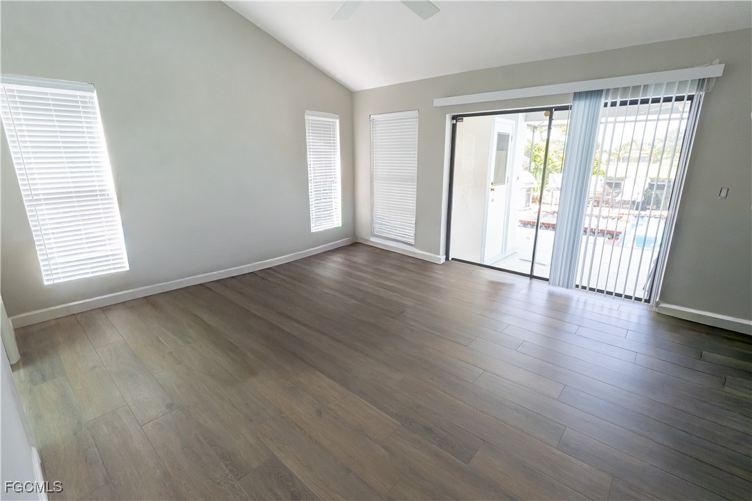 14557 Eagle Ridge Drive Fort Myers, FL 33912 - Photo 17 of 20 an empty room with wooden floor and windows