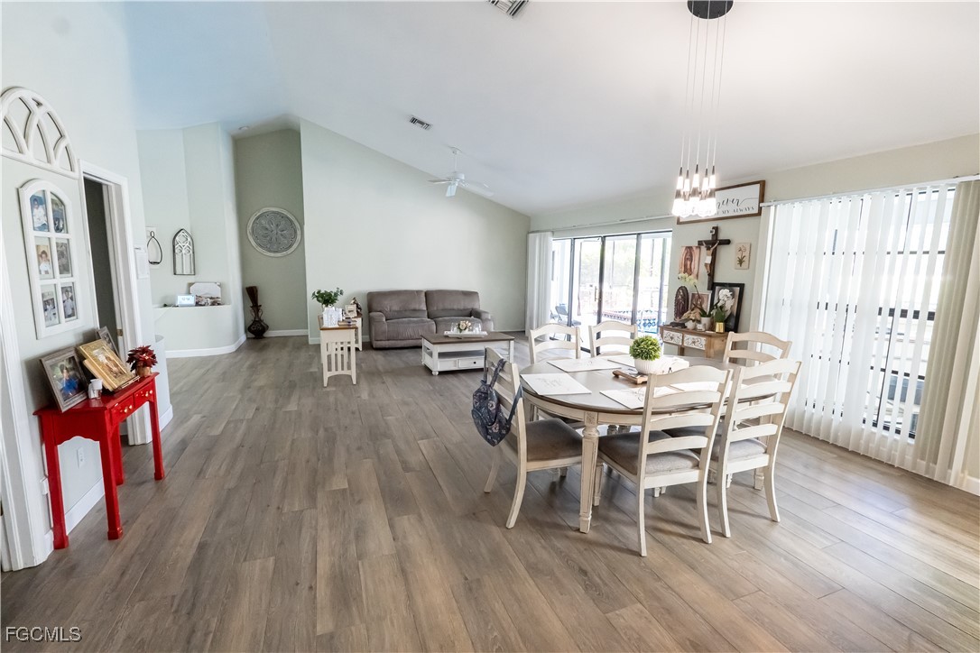 14557 Eagle Ridge Drive Fort Myers, FL 33912 - Photo 4 of 20 a view of a dining room with furniture and wooden floor
