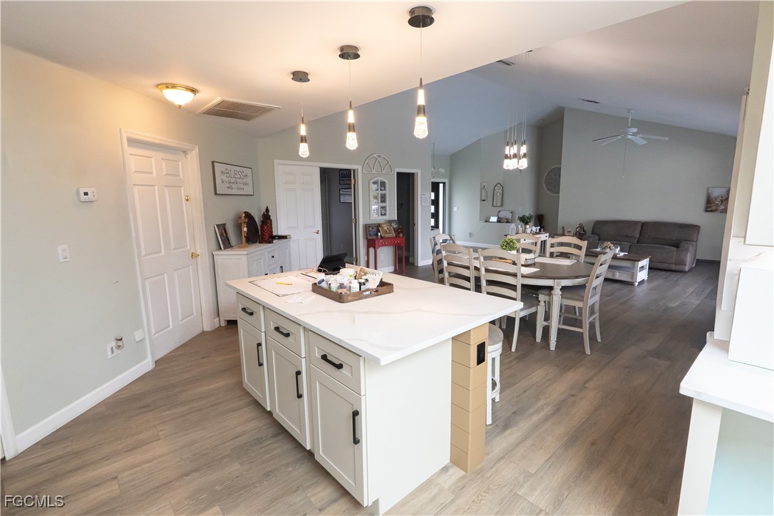 14557 Eagle Ridge Drive Fort Myers, FL 33912 - Photo 5 of 20 a kitchen with stainless steel appliances kitchen island a island in the center