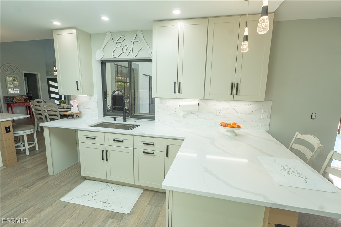 14557 Eagle Ridge Drive Fort Myers, FL 33912 - Photo 7 of 20 a bathroom with a tub sink and mirror