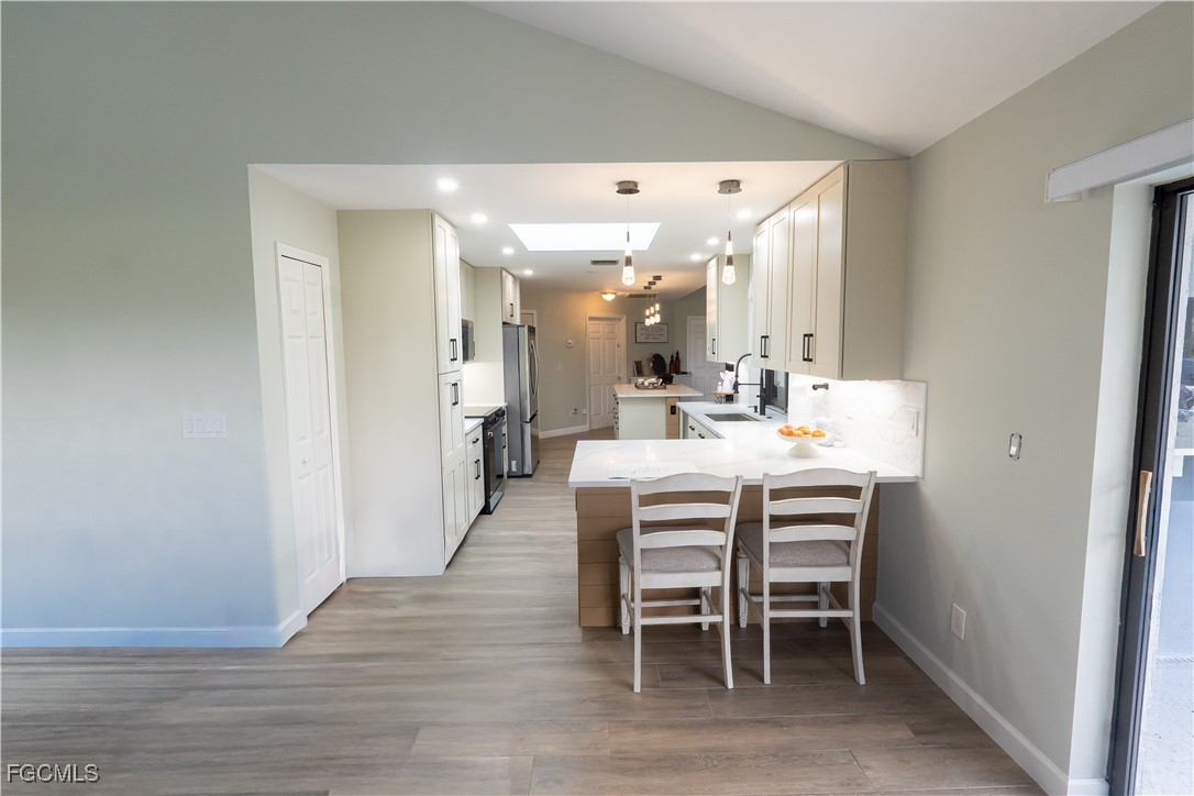 14557 Eagle Ridge Drive Fort Myers, FL 33912 - Photo 9 of 20 a dining room with furniture and wooden floor