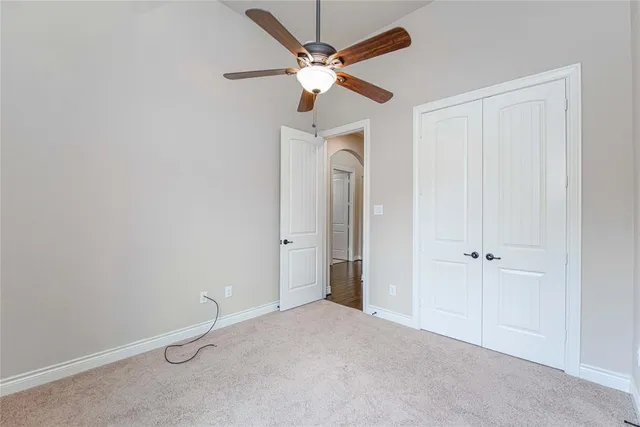 a view of a livingroom with a ceiling fan