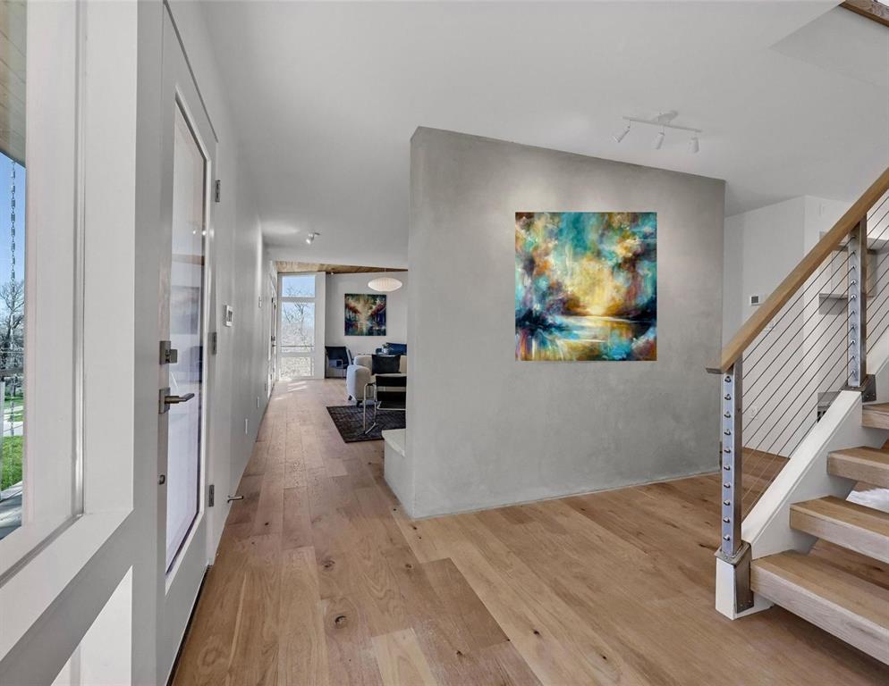 715 North Elm Street Sherman, TX 75090 - Photo 13 of 39 a view of a hallway with wooden floor and staircase