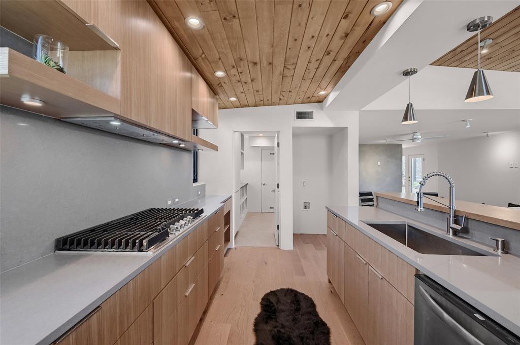 715 North Elm Street Sherman, TX 75090 - Photo 18 of 39 a kitchen with a sink a stove and cabinets