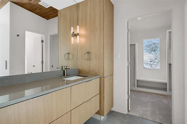 a bathroom with a glass shower door