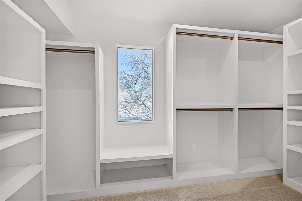 715 North Elm Street Sherman, TX 75090 - Photo 29 of 39 a bathroom with a glass shower door