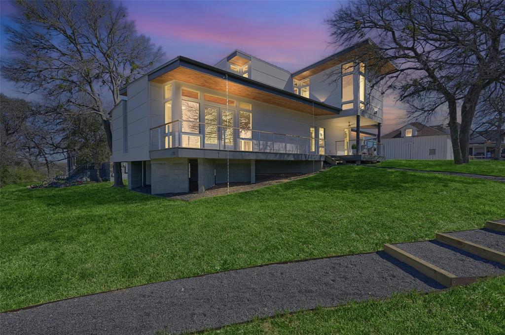 715 North Elm Street Sherman, TX 75090 - Photo 3 of 39 a view of a house with a backyard