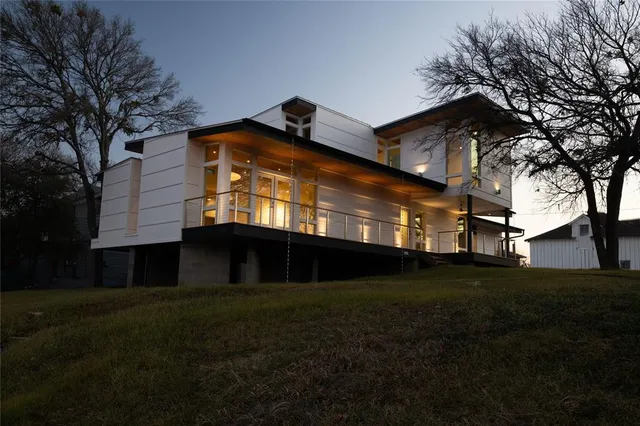 a view of house with backyard