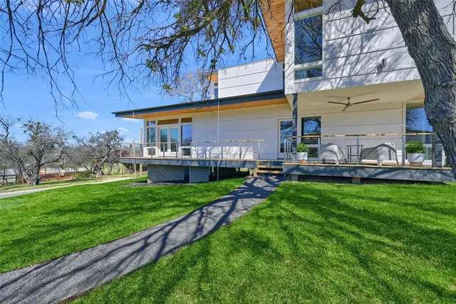 a view of a backyard with a garden and plants