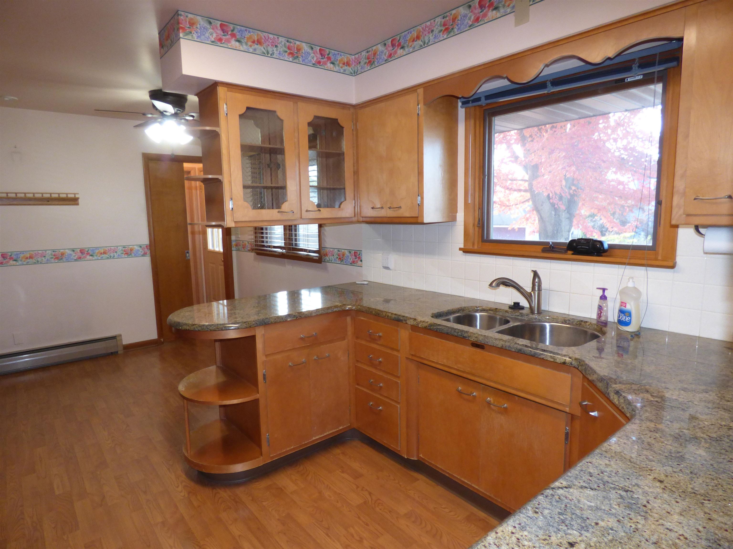 314 South Main Street Elizabeth, IL 61028 - Photo 4 of 43 a kitchen with stainless steel appliances granite countertop a sink and a microwave