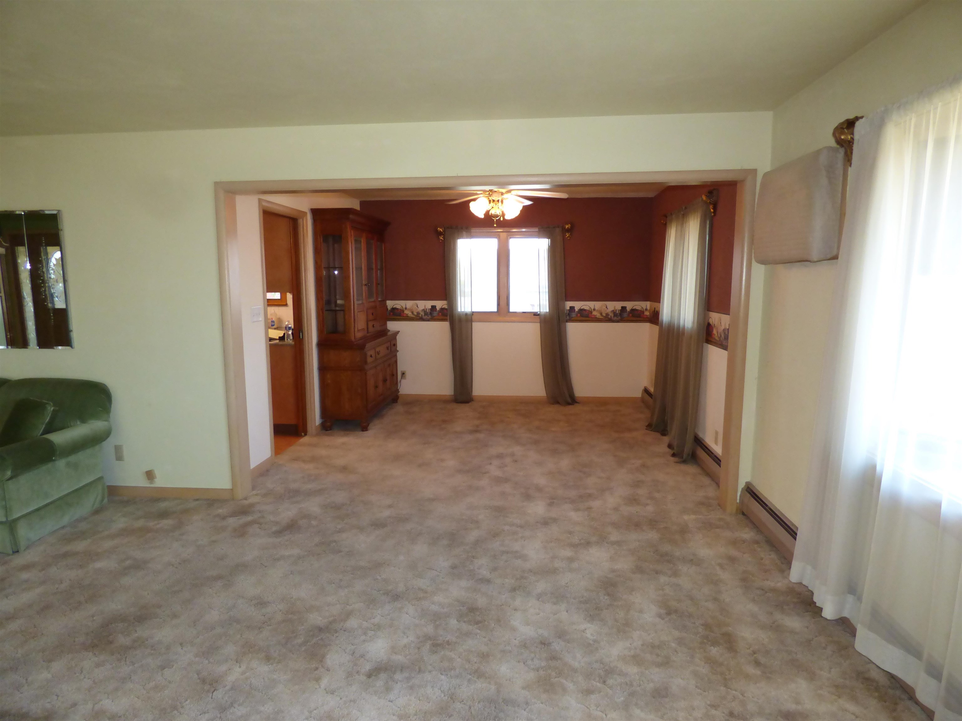 314 South Main Street Elizabeth, IL 61028 - Photo 8 of 43 an empty room with a door and windows