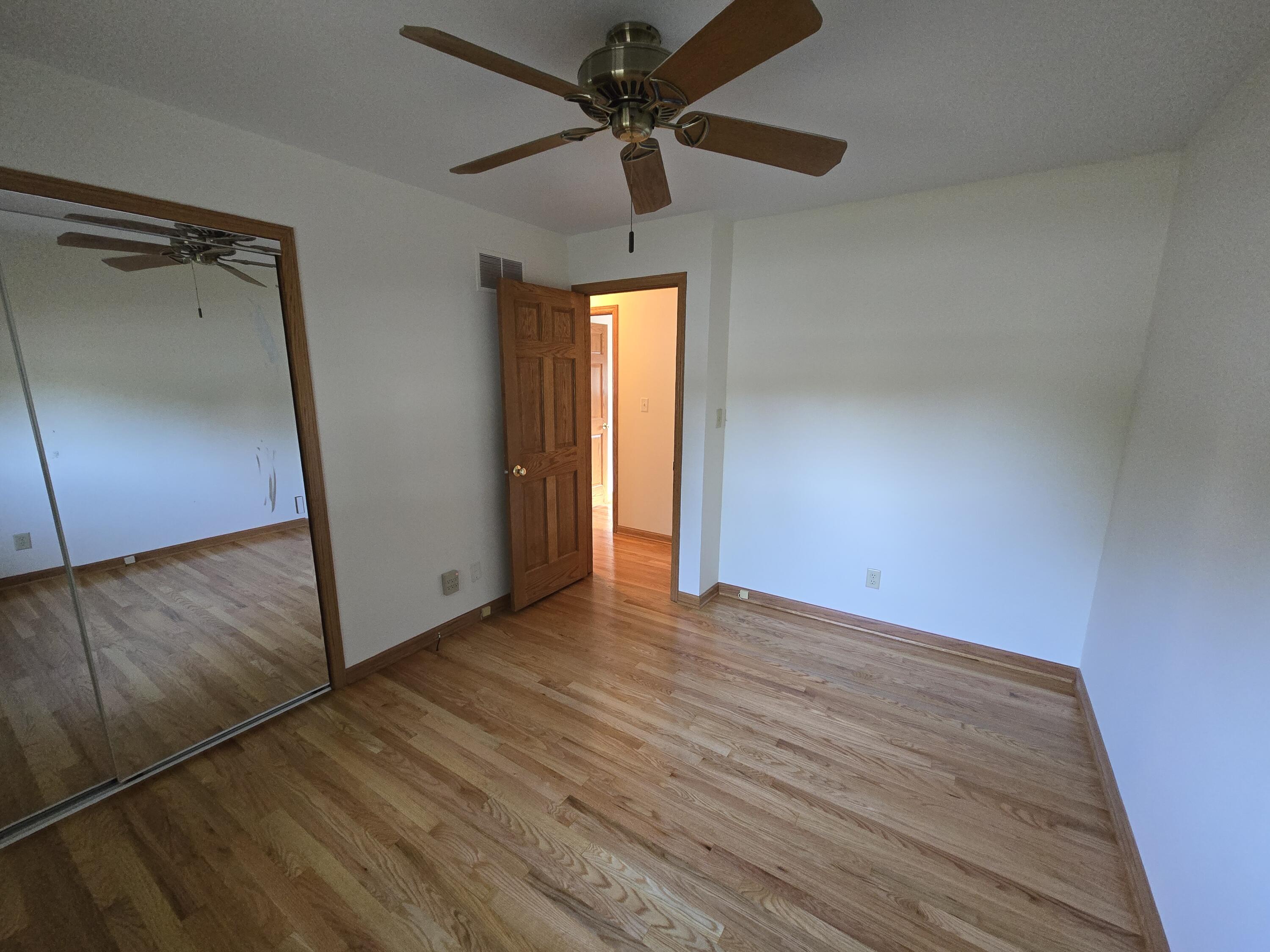 1828 Wren Drive Munster, IN 46321 - Photo 16 of 36 a view of empty room with wooden floor and fan