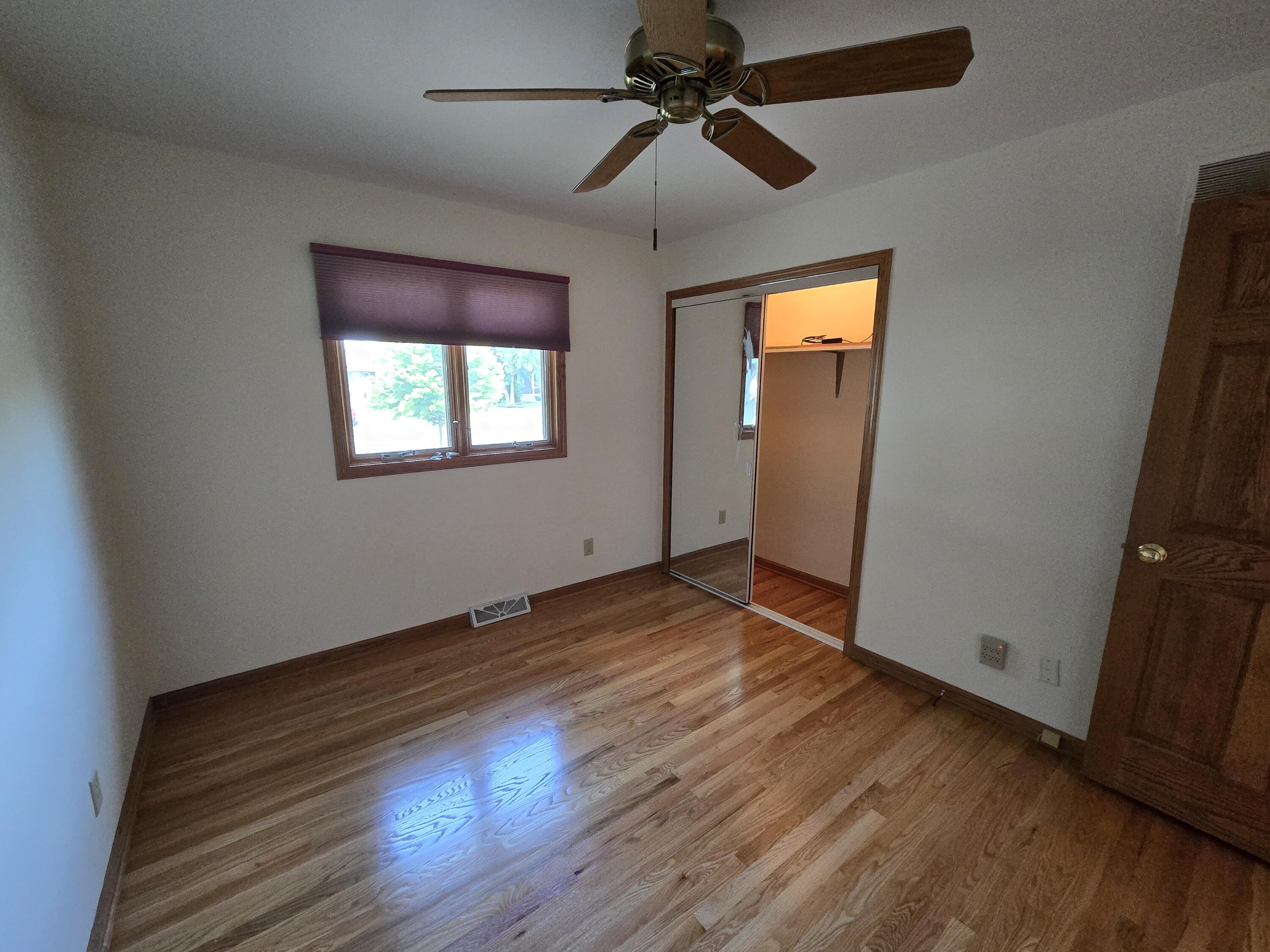 1828 Wren Drive Munster, IN 46321 - Photo 17 of 36 a view of empty room with wooden floor and fan